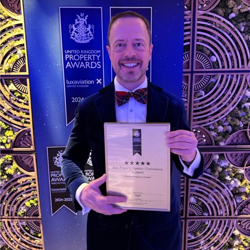 Mark Coulter holding the Best UK Property Consultancy award.