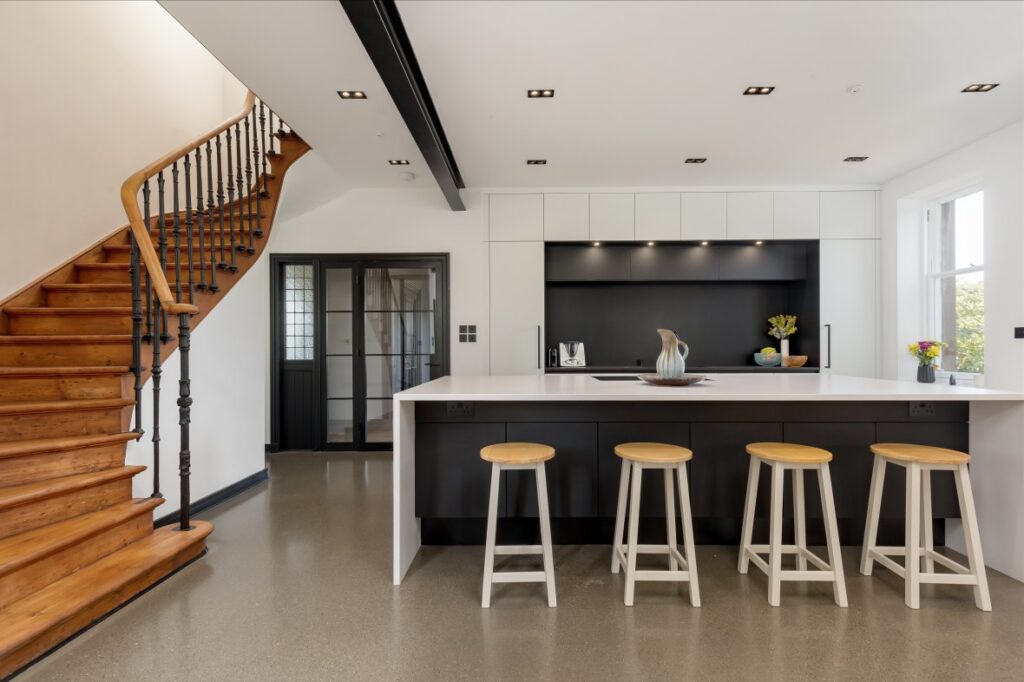 Image of Kitchen, showing staircase from Ellisons’ past prime and super prime properties projects in Scotland.