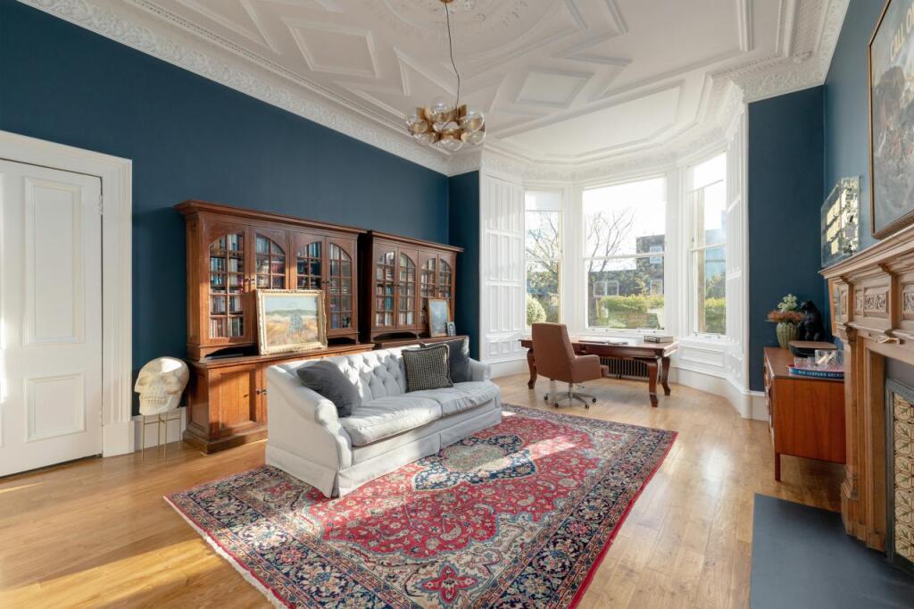 Image of living room, showing big bay windows from Ellisons’ past prime and super prime properties projects in Scotland.